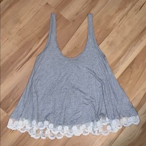 Grey flowy tank with lace detail on bottom